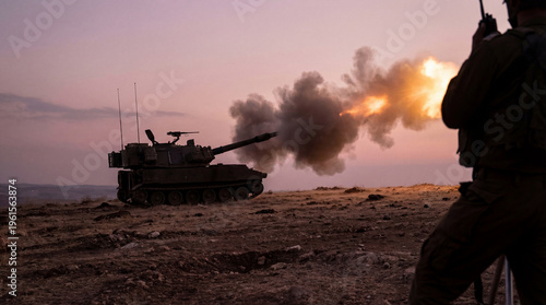 Powerful military self-propelled howitzer tank firing a shell, with smoke and fire in desert.