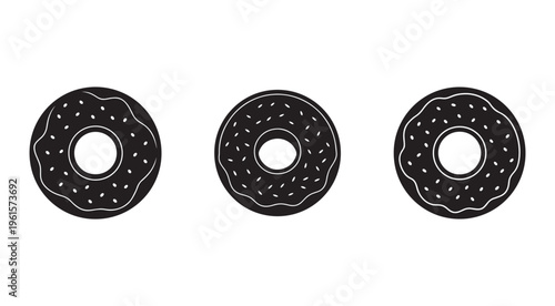 Chocolate frosted donuts with sprinkles in a row on white background  sweet treats
