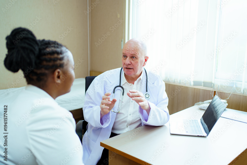 Fototapeta premium Doctor discussing or interviewing health with patient in examination room