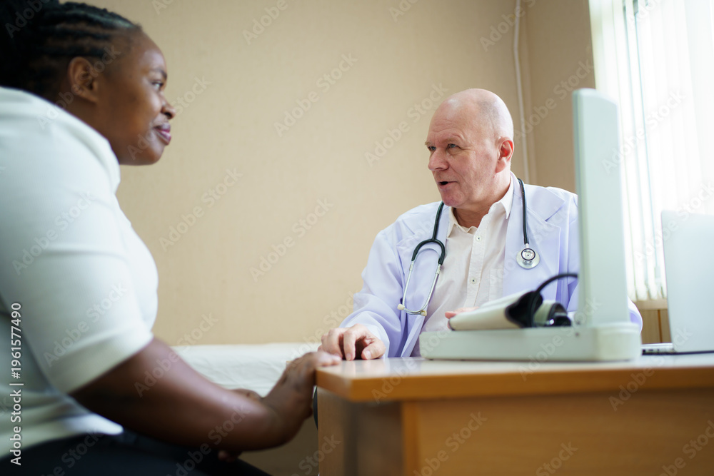 Fototapeta premium Doctor discussing or interviewing health with patient in examination room