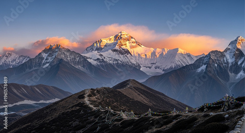 Snowy mountain range at sunrise.
