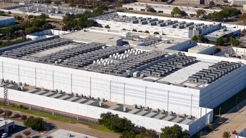 Aerial view of a large data center and its cooling systems