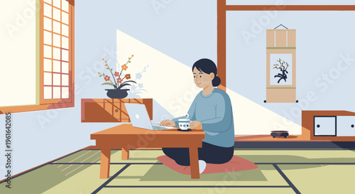 Woman sitting on a tatami mat in a traditional Japanese room working on a laptop with a cup of tea.