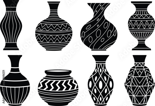 A collection of eight distinct black and white decorative pottery vases with intricate patterns
