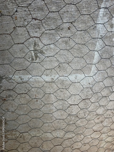 Hexagonal Chicken Wire Mesh on Wooden Background