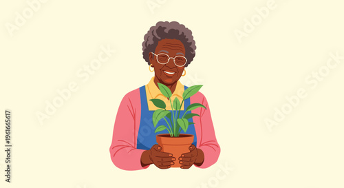 Smiling senior African American woman wearing an apron and holding a terracotta pot with a green plant.