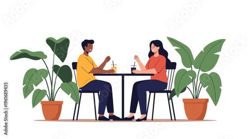 Happy couple enjoys a casual conversation over drinks at a table surrounded by lush green potted plants in a bright room.