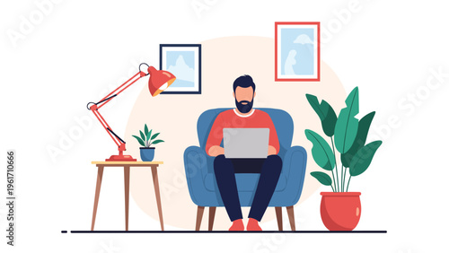 Professional man working from home on a laptop while sitting in a comfortable blue armchair in a modern living room.