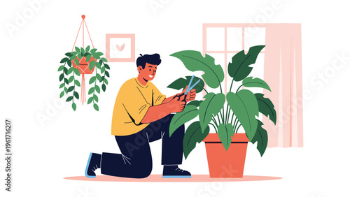Young man taking care of his indoor garden by pruning the leaves of a large houseplant with scissors in a bright room.