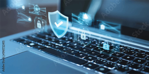 Close-up on laptop keyboard with transparent digital shield and lock icons symbolizing cyber security and online data integrity with lock icon