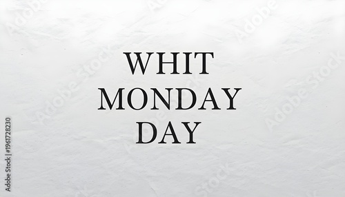 A close-up of a piece of paper with the words Whit Monday Day written on it