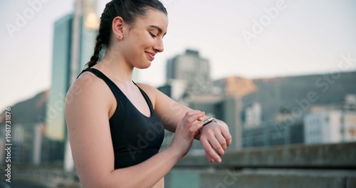 Free Download Fitness, smile and time with woman in city for progress, training or workout tracking as runner. Buildings, exercise and watch with happy athlete outdoor in urban town for health or wellness activity - GFXLoad