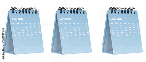Sequence of three 2027 monthly flip calendars on stands. Modern minimalist layout for scheduling tasks and important dates. High resolution image for web design and corporate identity.
