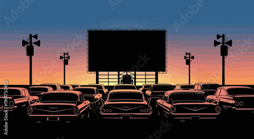 Vintage cars parked at a drive in movie theater at sunset with a large screen