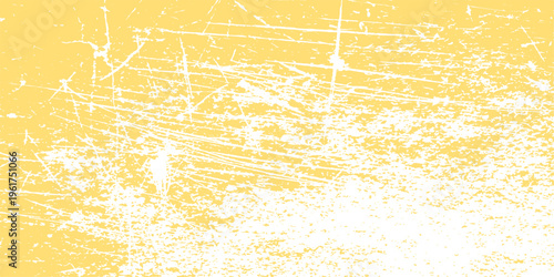 Abstract distressed yellow texture with scratch marks, creating a unique background that exudes a sense of weathered charm and visual intrigue.