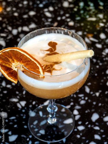 Vintage champagne glass drink garnished with a lemon slice