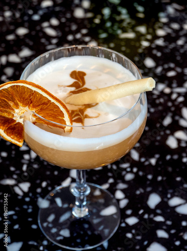 Vintage champagne glass drink garnished with a lemon slice