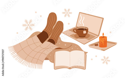 Person unwinding at home during winter with comfy socks, a steaming cup of tea, and a laptop