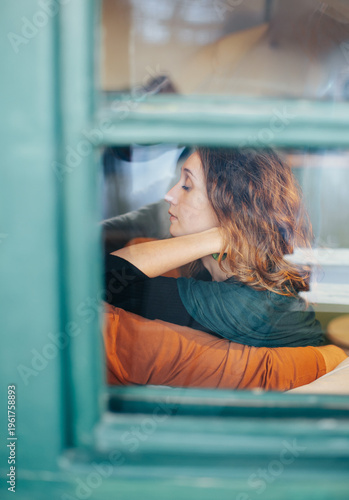 Woman Resting by Window