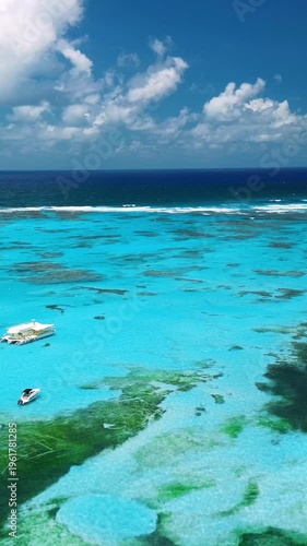 Tropical island waters with boats from a bird’s-eye view, shallow water