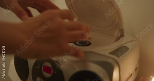 Placing CD into Player with Candle Close