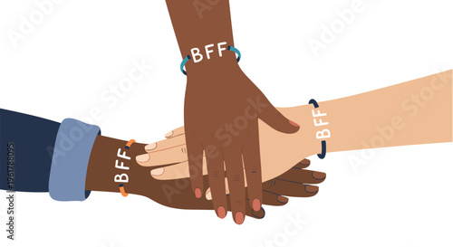A diverse group of friends with their hands stacked together wearing matching bff bracelets to show unity and strong friendship.