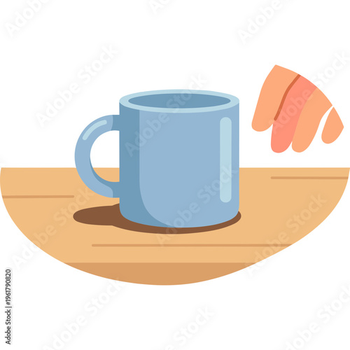 A hand placing a blue coffee mug on a wooden table indoors.