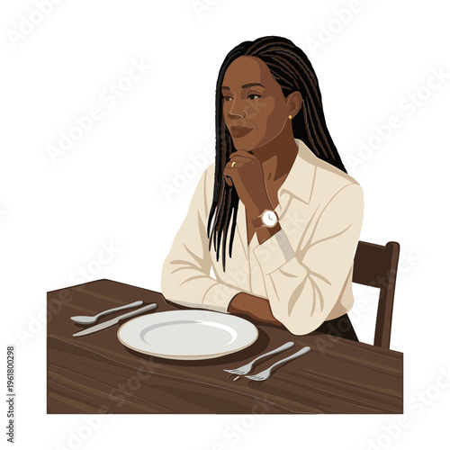 A woman sits alone at a table with a plate and utensils.