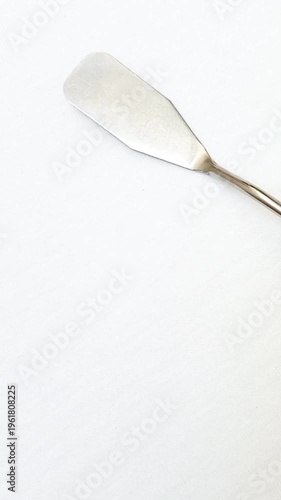 Stainless Steel Palette Knife with Wooden Handle rotating on White Background, Artist Painting Tool for Acrylic and Oil Painting, vertical clip