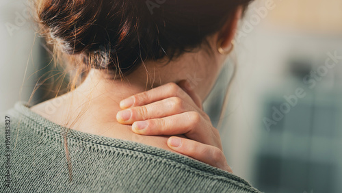 Konstfotografi Young woman suffering from nape pain