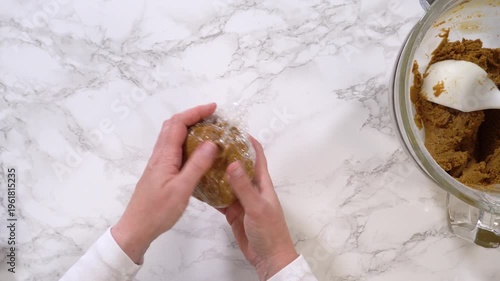 Hands Shaping Brown Dough Ball