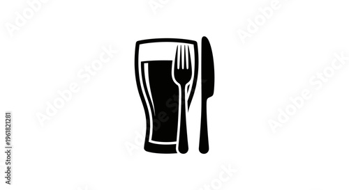 A glass of beer with a fork and knife on a table setting