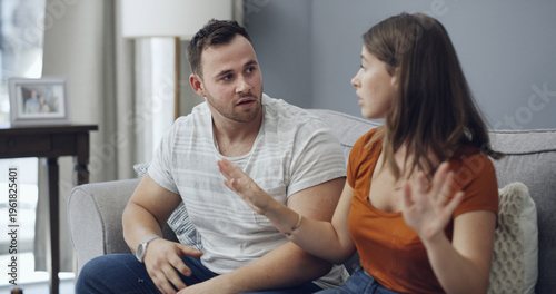 Photos Fighting, upset and couple on sofa in home with relationship problem, cheating or affair conflict