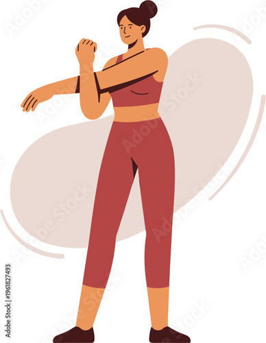 Woman in red outfit stretching her arms in a fitness studio environment