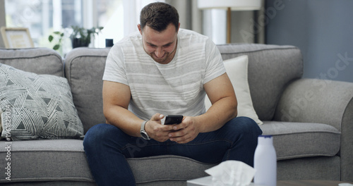 Принти на полотні Man, smile and scroll in living room with phone, download app and search website for pornography