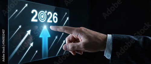 Futuristic business strategy planning for 2026 hand pointing at targeted growth metrics on digital interface dark environment conceptual visualization