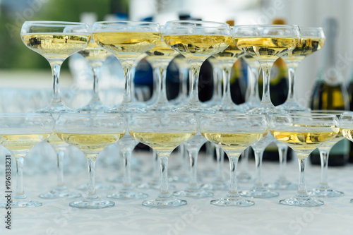 Elegant Champagne Glass Pyramid Tower Filled with Sparkling Wine at a Celebration
