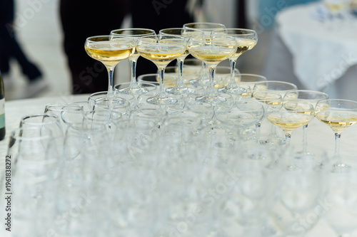 Elegant Champagne Glass Pyramid Tower Filled with Sparkling Wine at a Celebration