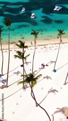 Aerial view of tropical beach, luxury resort with white sand on bright sunny day