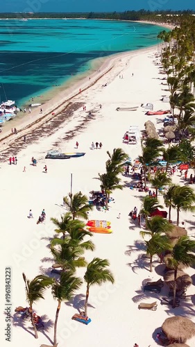 Aerial view of tropical beach, luxury resort with white sand on bright sunny day