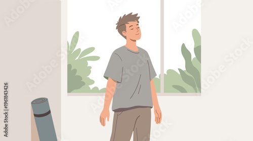 Man standing in a room looking out the window at plants