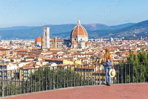 Fotografija Woman tourist admiring Florence skyline with Duomo and Giotto's Bell Tower from