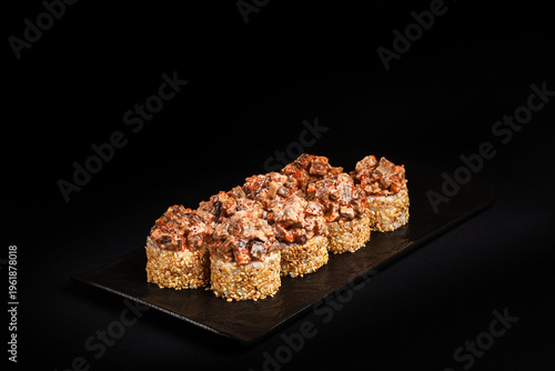 Delicious Fresh Salmon Sushi Rolls Presenting Exquisitely on a Black Background