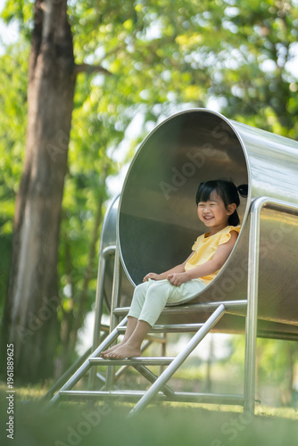 Asian children play in a park on a playground summer day. children playground in a public park, entertainment and recreation for children, holiday, IQ, EQ, Relax, Development