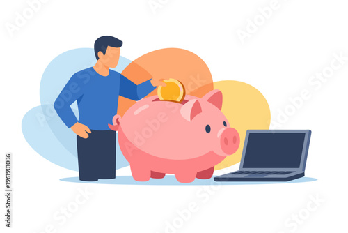 Man saving money in piggy bank with laptop nearby.