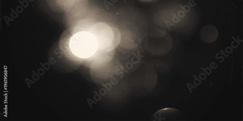 Abstract bokeh lights glow in the dark night sky with colorful blurred motion and a bright moon shining through gray clouds