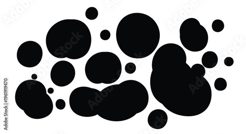 A collection of varying sized black circles scattered across a white background