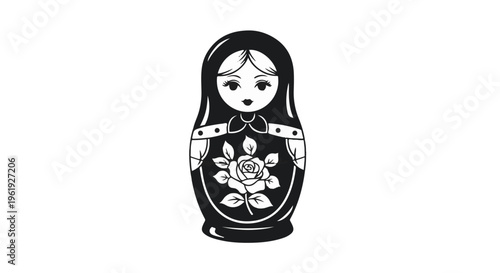 Traditional black nesting doll with floral motif on a white background