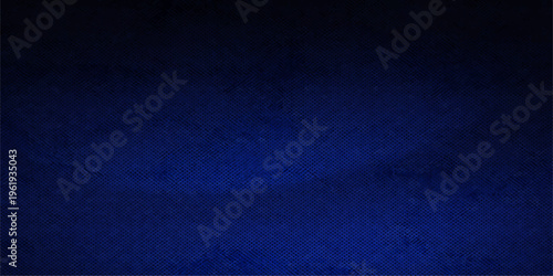 Dark blue abstract background featuring a rough grunge texture on vintage denim fabric and textured paper material for a dark canvas wallpaper design