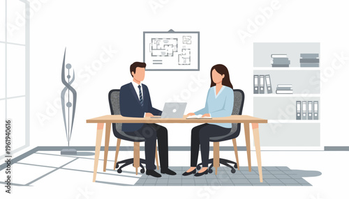 Business meeting in a modern office with two professionals discussing plans on a laptop at a desk